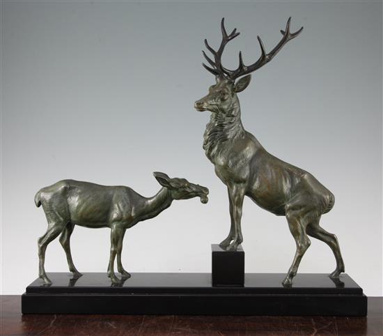 An Art Deco patinated metal study of a stag and doe, 19in.